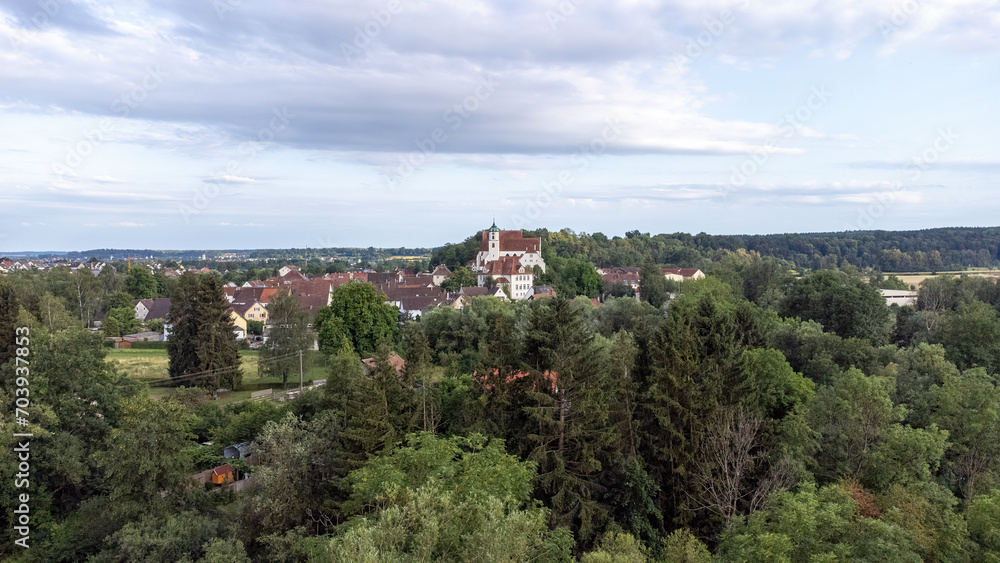 Scheer on the Danube river with St. Nicholas Church, taken from the air, drone image