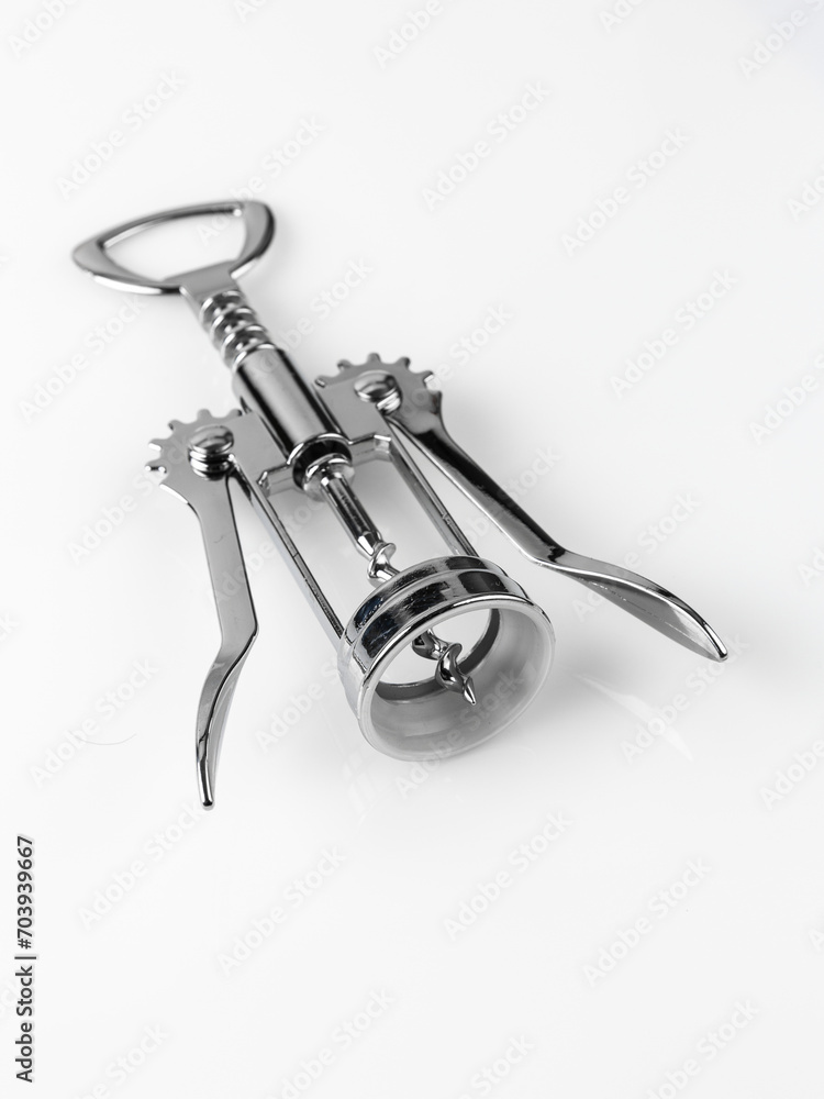 Glossy metal wine bottle opener isolated over the white background Glossy metal wine bottle opener isolated over the white background