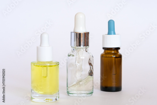 Set different cosmetic jars with pipettes. Blank packaging. Natural beauty spa product concept. Beauty and medicinal drops. Mock-up