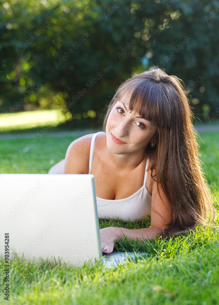 Happy young girl having fun using a computer Happy young girl having fun using a computer