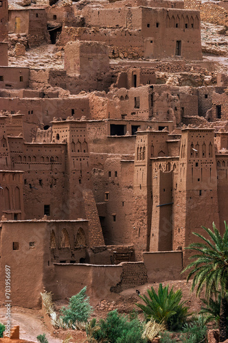 Walls and towers of ksar Ait BenHaddou - fortified village, staying along the former caravan route between the Sahara and Marrakech in Morocco. Great example of Moroccan earthen clay architecture.