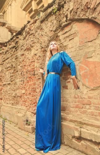 Beautiful blond woman in long dress outdoors © Dasha Petrenko