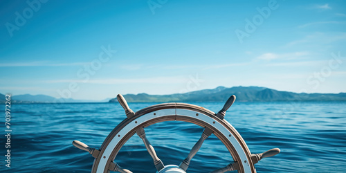 close-up of a boat's steering wheel, set against the vast, open expanse of the ocean under a clear sky