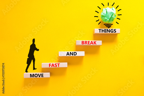 Move fast and break things symbol. Concept words Move fast and break things on wooden blocks. Beautiful yellow background. Businessman icon. Business, move fast and break things concept. Copy space.