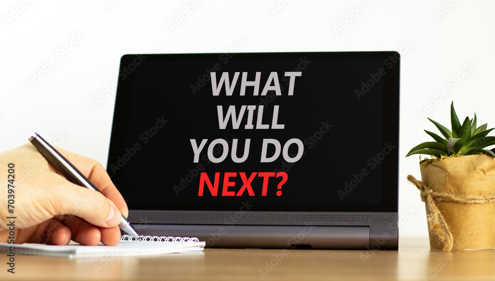 What will you do next symbol. Concept words What will you do next on beautiful black tablet. Beautiful white background. Businessman hand. Business, what will you do next concept. Copy space. What will you do next symbol. Concept words What will you do next on beautiful black tablet. Beautiful white background. Businessman hand. Business, what will you do next concept. Copy space.