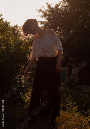 young lady walks in the garden