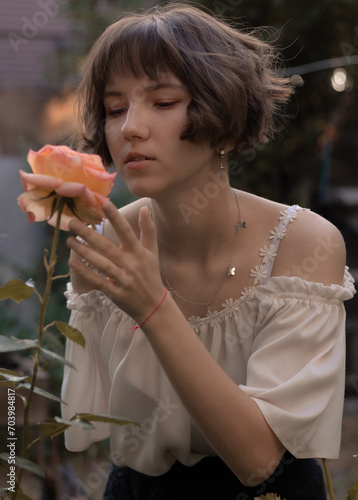 girl smelling flower