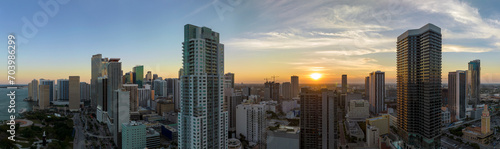 Aerial view of downtown office district of Miami Brickell in Florida, USA at sunset. High commercial and residential skyscraper buildings in modern american megapolis photo