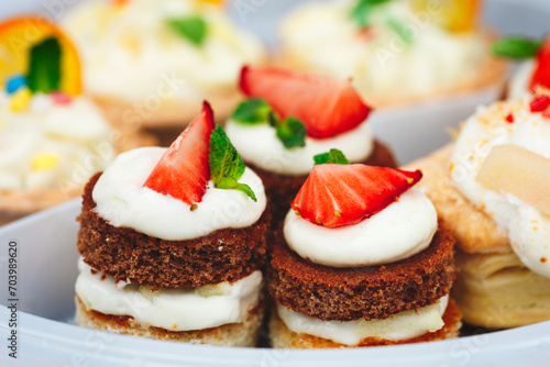 Strawberry cake, vanilla sponge cake with cream cheese and fresh strawberries. Summer cake. Selective focus