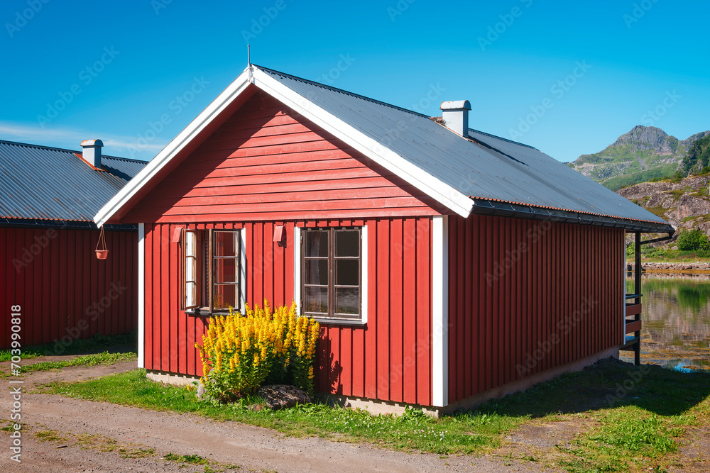 Traditional little red Scandinavian Swedish houses, Summer view of a red house Scandinavia Norway, vacation travel concept
