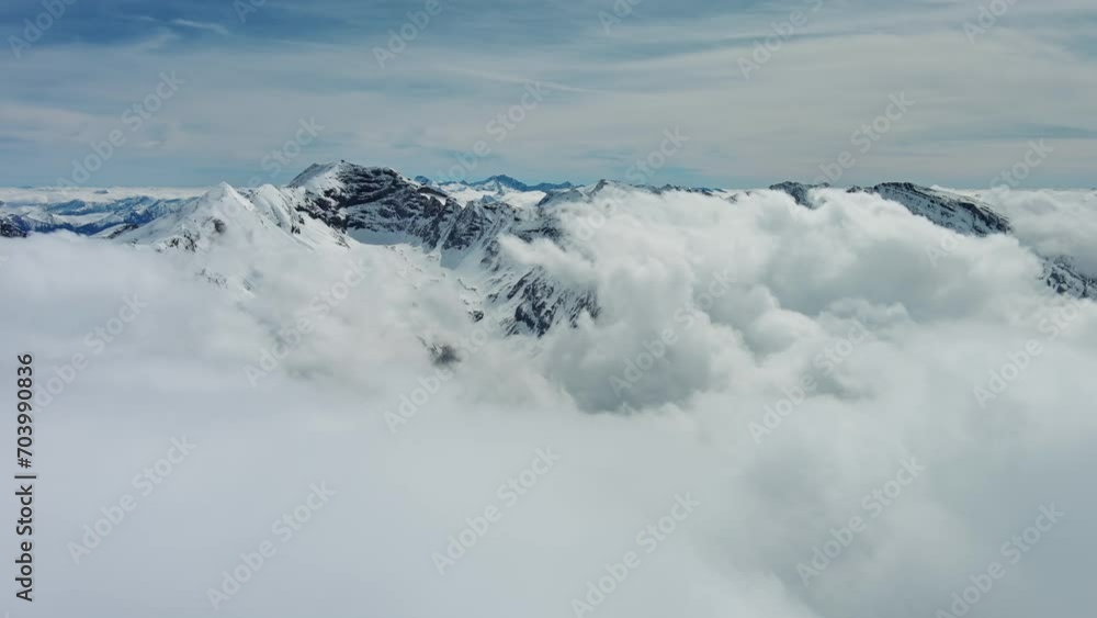 Aerial view of snow mountain range landscape with moving clouds. Alps mountains, Austria, 4k Aerial view of snow mountain range landscape with moving clouds. Alps mountains, Austria, 4k