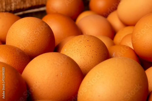 lots of chicken eggs piled up. background of chicken eggs