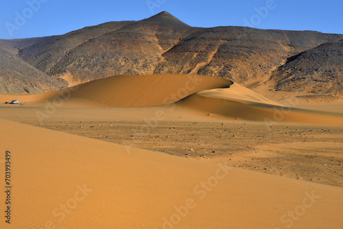 SAND DUNES IN THE SAHARA DESERT AROUND TADRART ROUGE PROVINCE AND DJANET OASIS IN ALGERIA