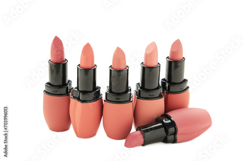 Many different lipsticks isolated on white background photo