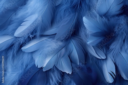  a bunch of blue feathers that are on a bed of blue feathers