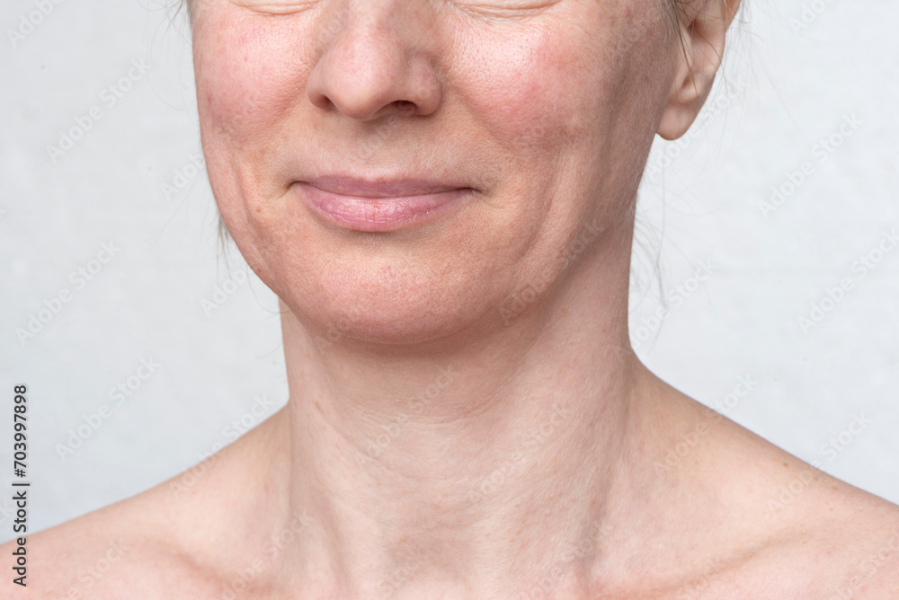 Obraz premium Untreated clean skin of an adult woman on a white background. Healthy face care and cosmetics concept
