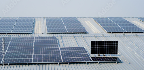 installing solar panels on a factory roof