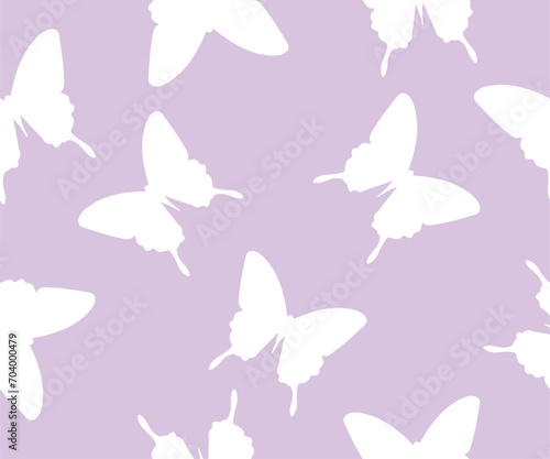 Seamless simple pattern with butterflies. Vector background in trendy retro trippy 2000s style.Lilac background. © Elis Iskrytska