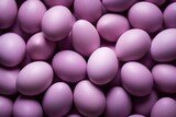  a pile of purple eggs sitting next to each other on top of a pile of other purple eggs on top of a pile of other purple eggs on top of each other.