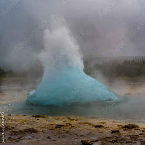 instant before the burst of a geyser in iceland