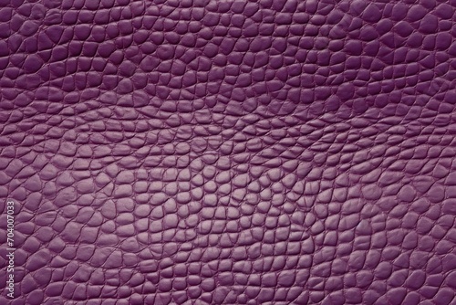  a close up view of a purple leather textured with a small amount of stitching on the outside of the leather, as well as well as well as the top part of the outer part of the outer part of the body 