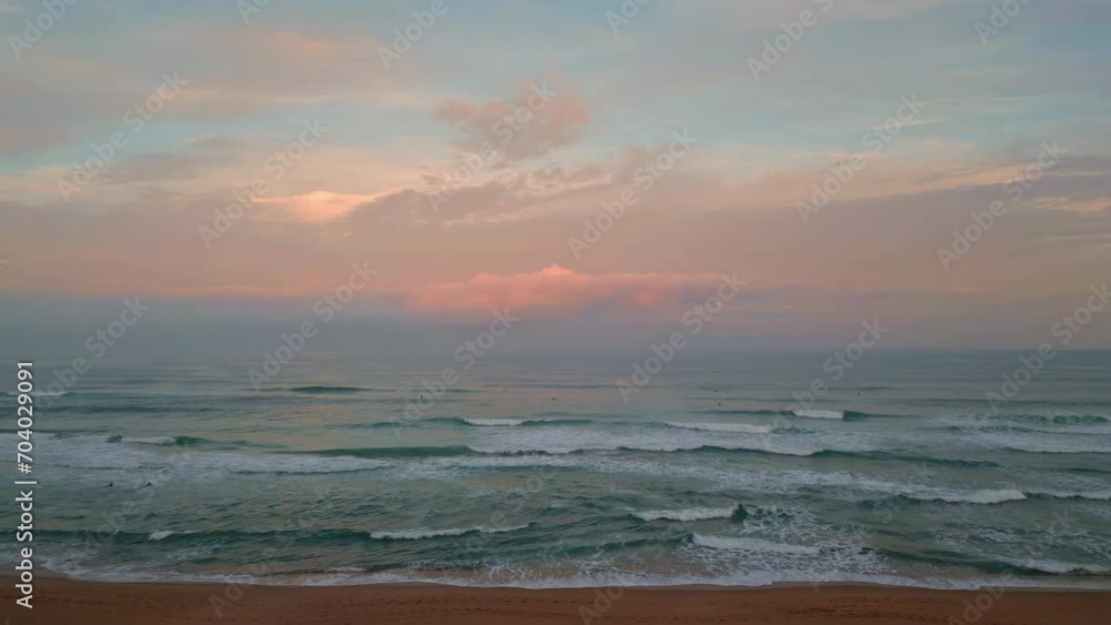 Amazing ocean sunset aerial view. Cinematic sea water washing sandy beach Amazing ocean sunset aerial view. Cinematic sea water washing sandy beach