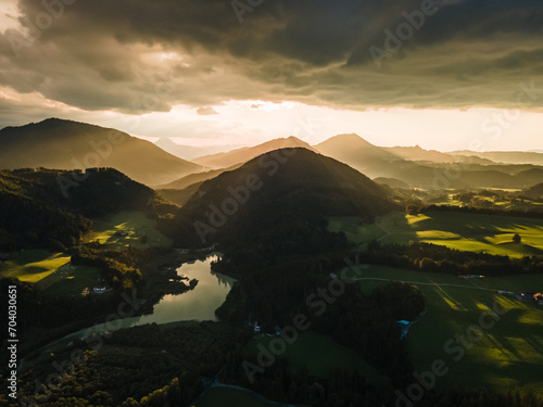 Dramatic Sunset Over a Charming Alpine Village and Church in the Austrian Alps