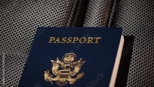 Close up angle of US passport on top of luggage photo