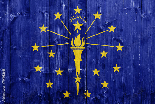 Flag of Indiana USA state on a textured background. Concept collage.