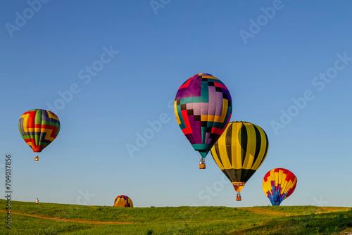 Spectacular Sky Ballet: Dazzling Balloons Paint the Blue Canvas with Joyful Colors