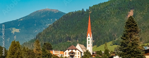 Alpine summer view with a church near Mieders, Stubaital valley, Innsbruck, Tyrol, Austria photo
