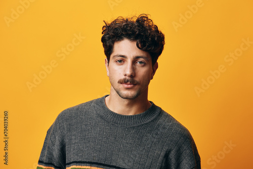 Natural man face portrait sweater background looking fashion happy smile trendy orange lifestyle hispanic student