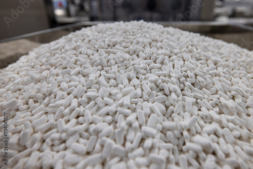 Pile pf pills in pharmaceutical factory