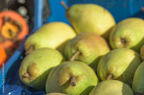 green pears in a box near the store 1