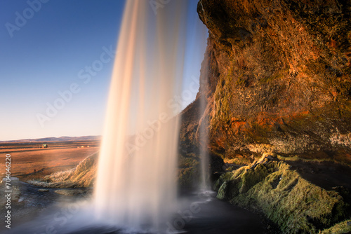 Amazing view from behind the Seljalandsfoss Waterfall at sunset,  Iceland