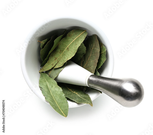 Dried bay leaves in a white...