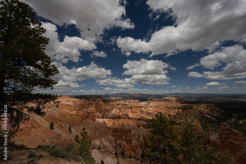 Puffy Clouds And Dark Blue Skies Over Bryce Amphitheater