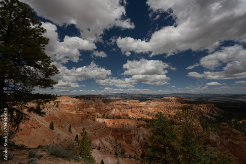 Puffy Clouds And Dark Blue Skies Over Bryce Amphitheater