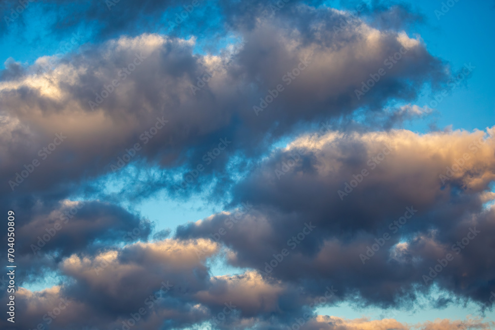 Fototapeta premium Stratocumulus clouds with a blue sky on a November morning