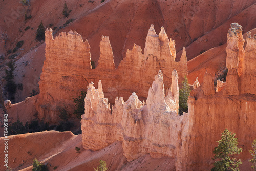 Unique rock formations called hoodos, beautifully glowing in the afternoon light.