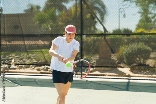 Sporty young woman working out playing tennis © AntonioDiaz