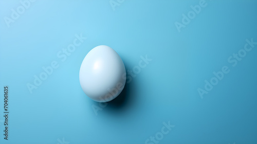 Top view blue easter egg on a blue background. 3d design  minimalist  copy space. Easter festive background.