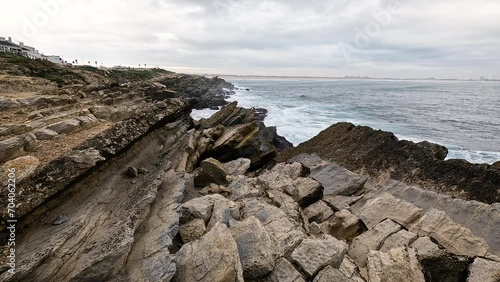 rocky coast of the Atlantic ocean at Baleal peninsula, Ferrel, municipality of Peniche, district of Leiria, Portugal photo