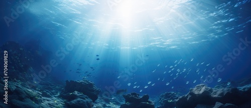 Underwater seascape with sunlight piercing through. Marine life and exploration. photo