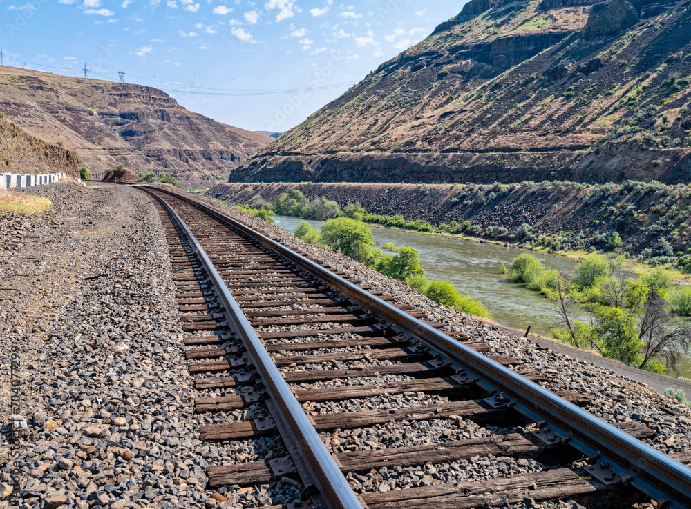 Railroad tracks of the Oregon Trunk Subdivision run along the Deschutes River near Tygh Valley, Oregon, USA Railroad tracks of the Oregon Trunk Subdivision run along the Deschutes River near Tygh Valley, Oregon, USA