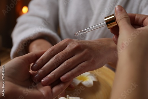 Woman receiving hand treatment in spa  closeup