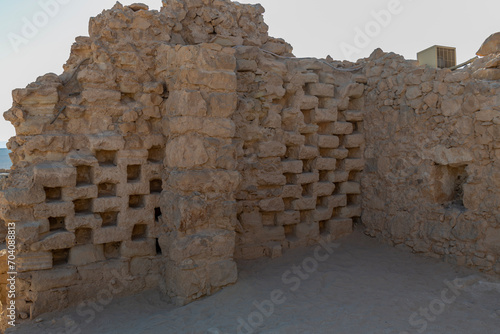 The ruins of ancient dovecotes towers on Masada in the Judean Desert in Israel. 