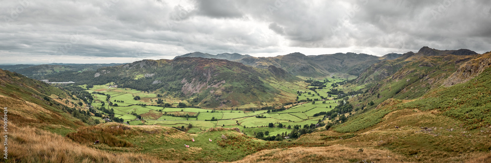 Panorama of Great Landgdale valley from Blea Rigg with Coniston Old Man, Bowfell and the Langdale Pikes on the skyline, Lake District, UK