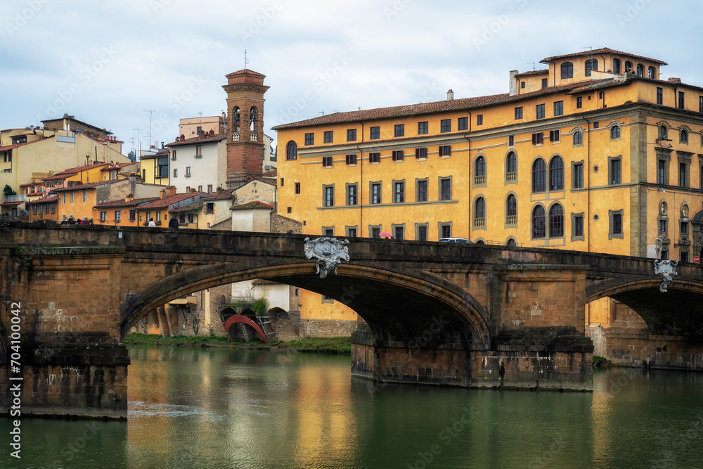 Winter rainy Florence. Bridges over the Arno River and Medieval Architecture.