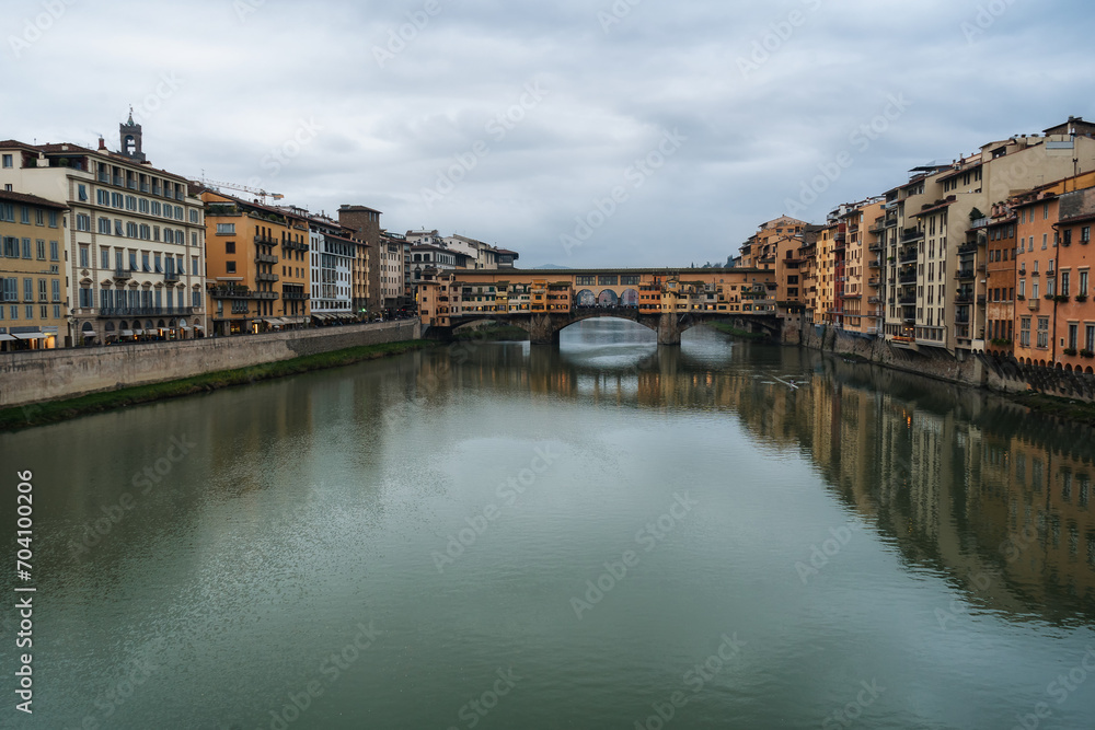 Winter rainy Florence. Bridges over the Arno River and Medieval Architecture.